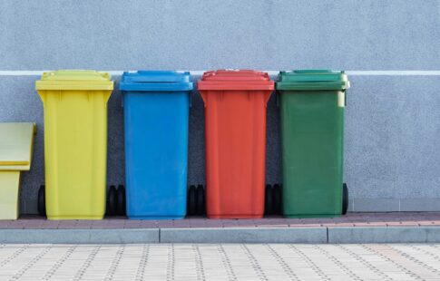 Yellow, blue, red and green recycling bins