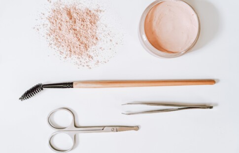 Makeup kit pieces on a white background
