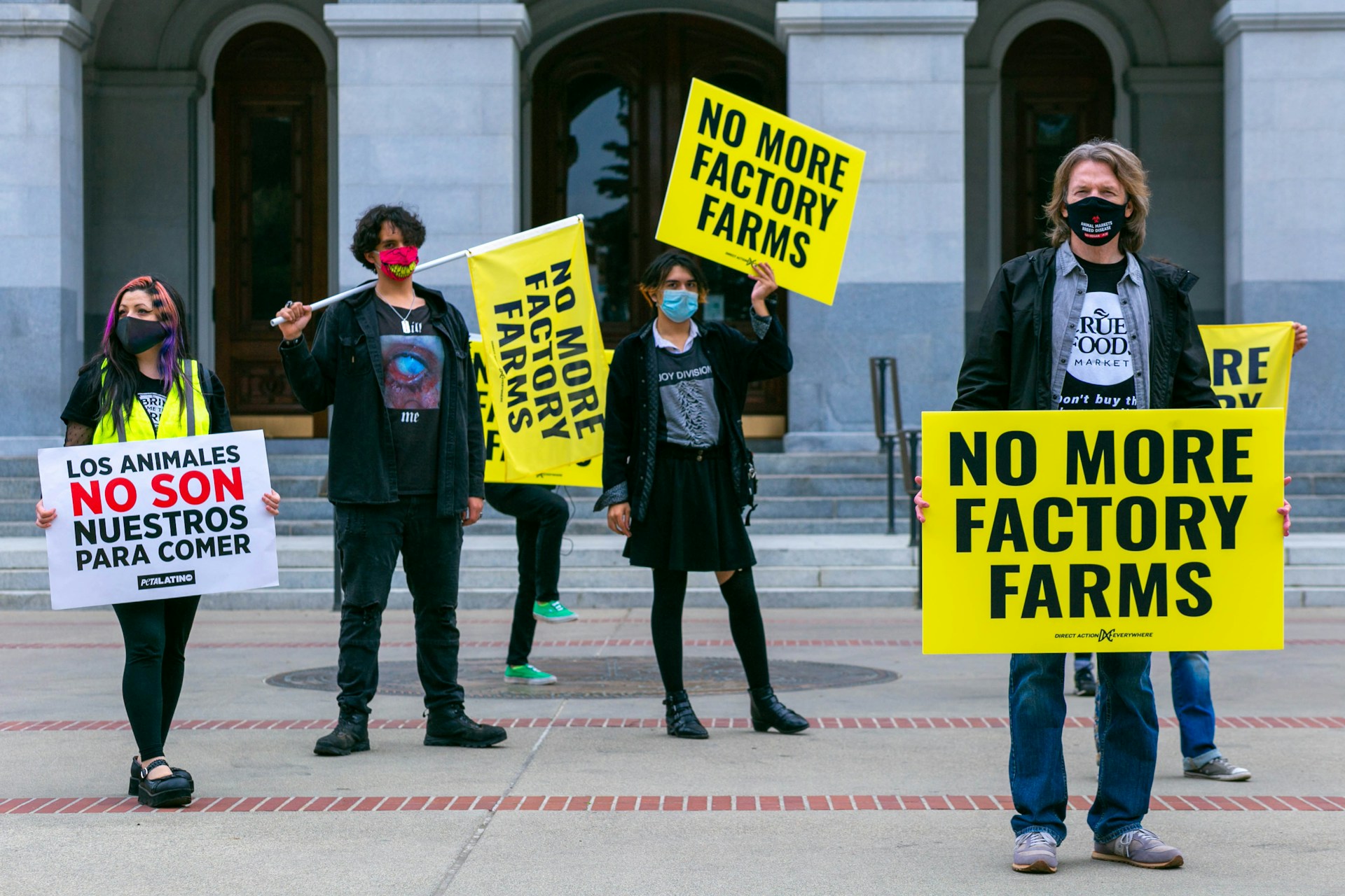 People holding signs in animal welfare protest