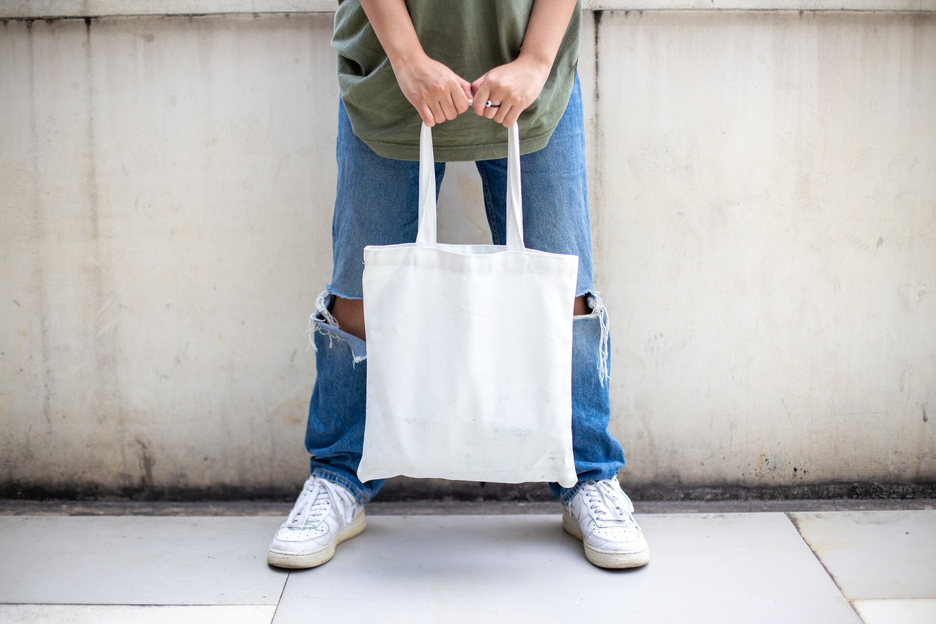 Person holding a tote bag