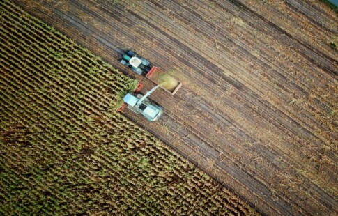tractor plowing a wide field