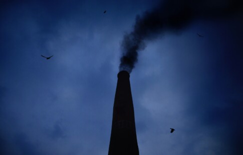 dark smoke coming out of a chimney