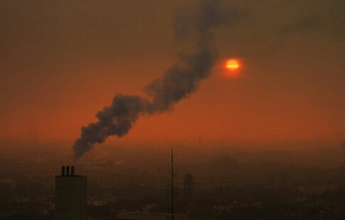 factory spewing fumes into the atmosphere